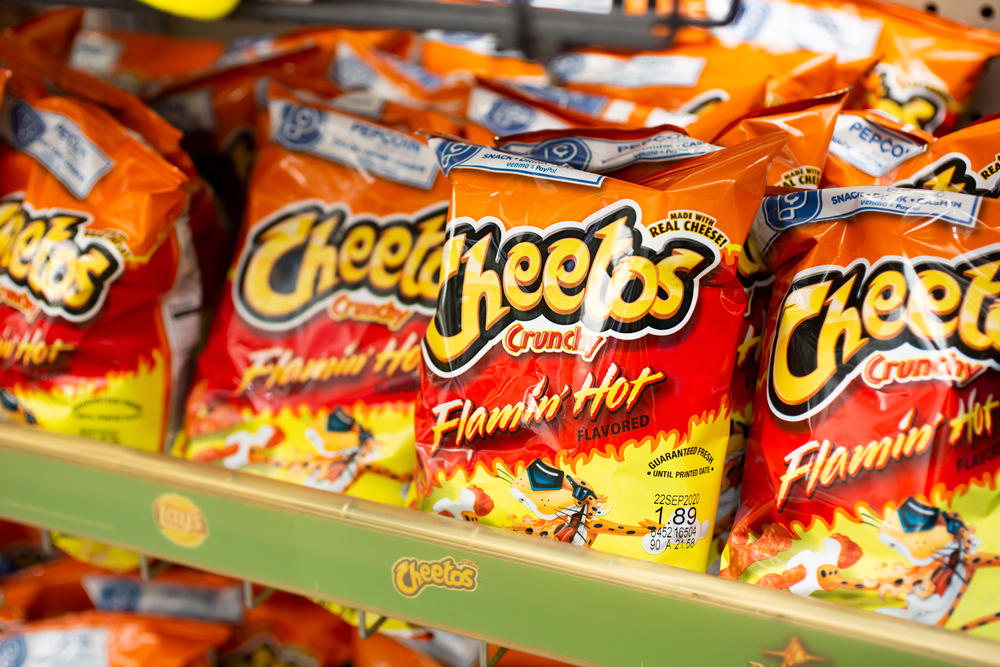 Los Angeles, California, United States - 07-22-2020: A view of several bags of Cheetos Crunchy Flamin' Hot chips, on display at a local grocery store.