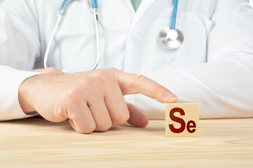 essential element and minerals for humans. doctor recommends taking selenium. doctor talks about the benefits of selenium. selenium - Health Concept. Se alphabet on wood cube.