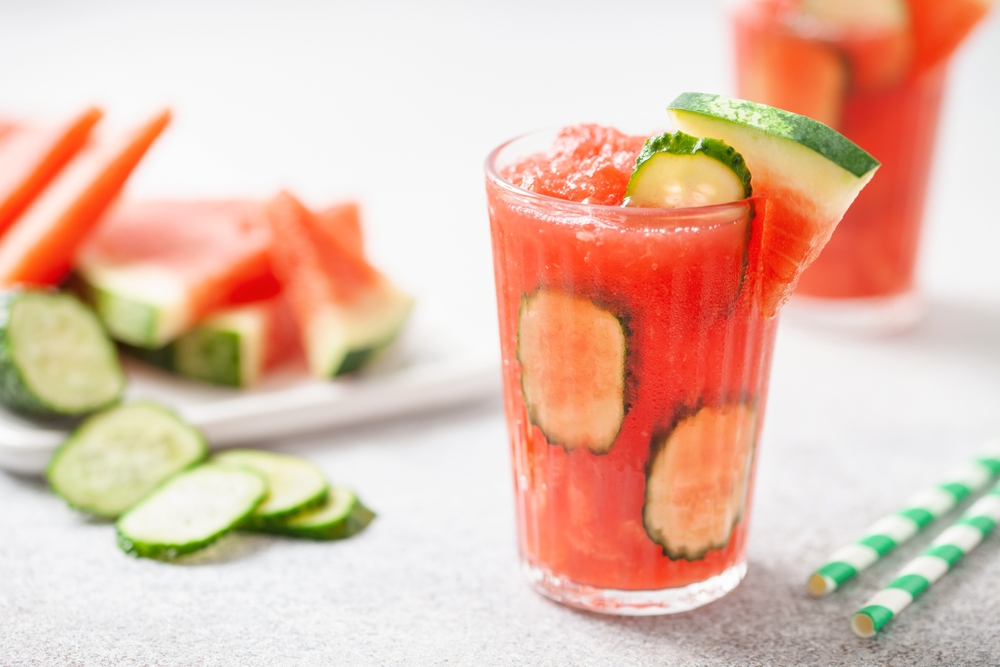 Refreshing cold summer drink watermelon slushie  with cucumber slices in glass