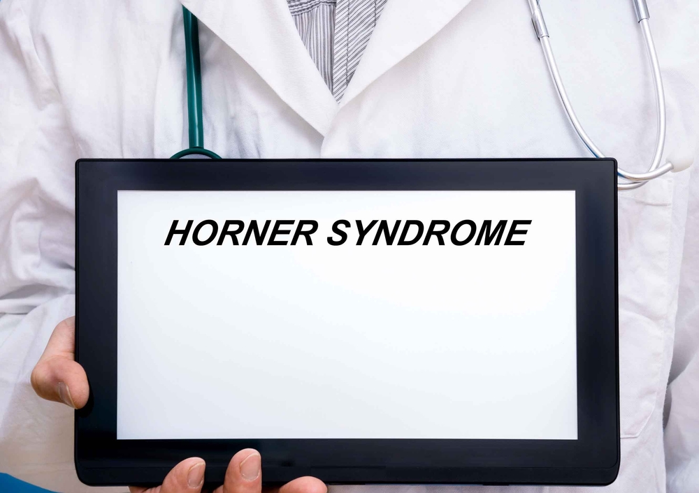 Horner Syndrome.  Doctor with rare or orphan disease text on tablet screen Horner Syndrome