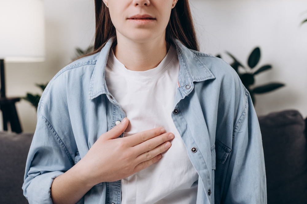 Cropped shot unhealthy sad caucasian woman having or symptomatic reflux acids, Gastroesophageal reflux disease, Because the esophageal sphincter separates the esophagus. Stomach dysfunction concept