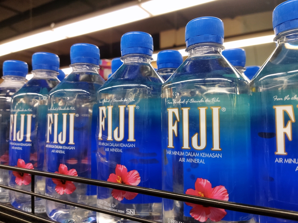 Jakarta, March 6, 2024 : Grocery store shelf with bottles of Fiji water. Fiji Water is a brand of bottled water imported from Fiji