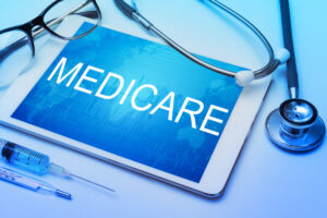 What You Must Know Before Signing Up for Medicare in 2026 Medicare,Word,On,Tablet,Screen,With,Medical,Equipment,On,Background