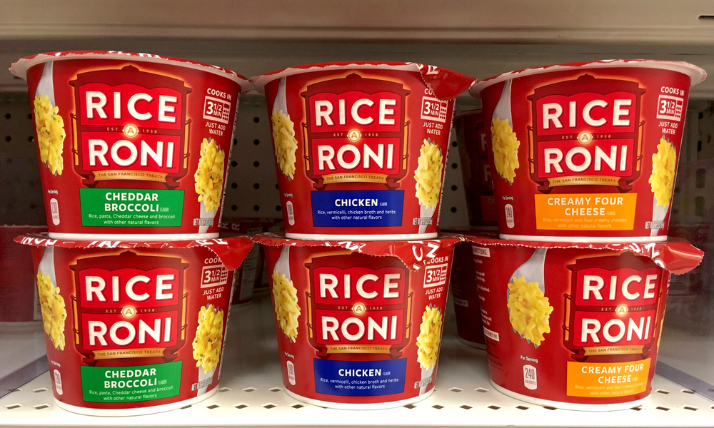 Alameda, CA - August 17, 2017: Grocery store shelf with cups of Rice a Roni brand instant rice. Cheddar Broccoli, Chicken flavor and Creamy Four Cheese. The San Francisco treat.