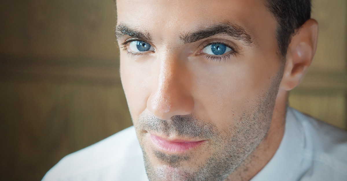 close up of man's face with blue eyes