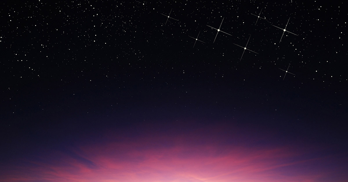 pink aura sitting blow a star lit night sky