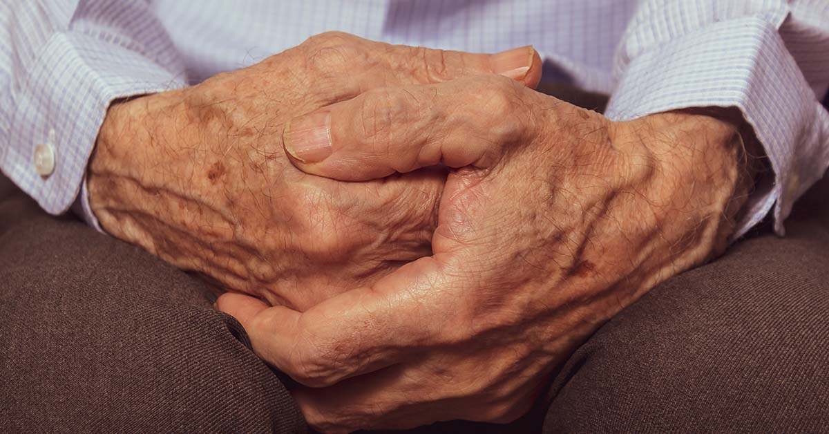 close up, pair of elderly hands clasped together