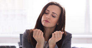 Woman Looking at her finger nails