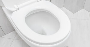 How Often You Poop Could Suggest More Than You Think, Study Finds white porcelain toilet
