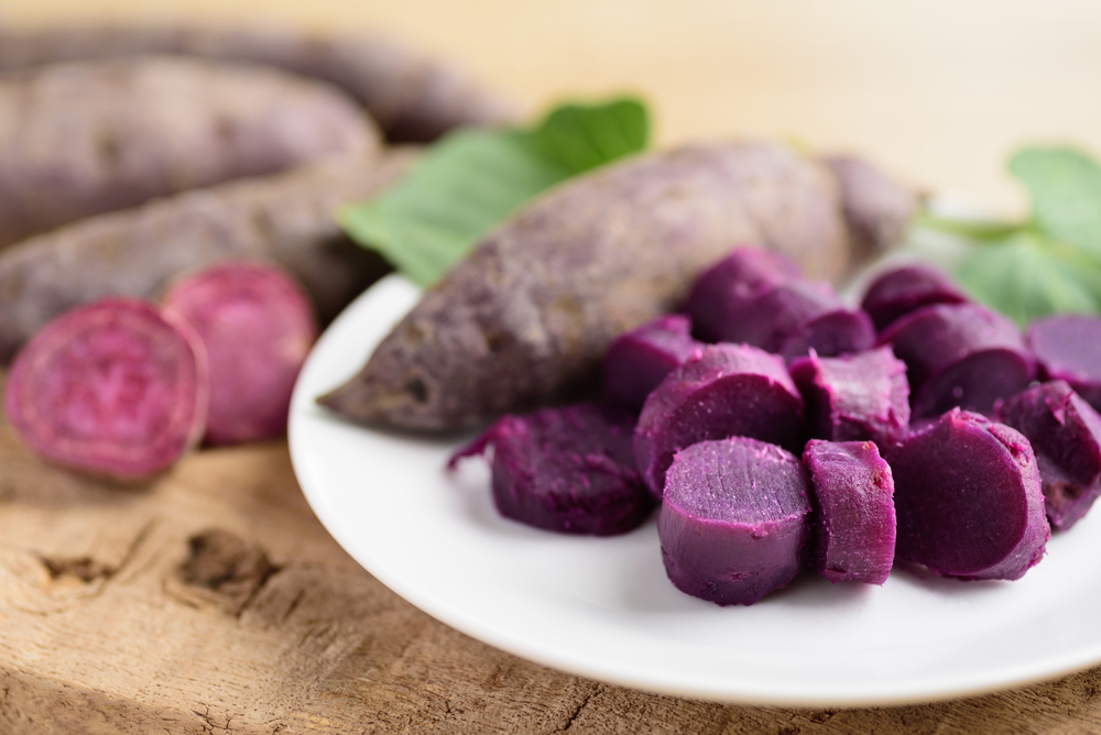 Sliced purple sweet potatoes on white plate ready to eating, Healthy food
