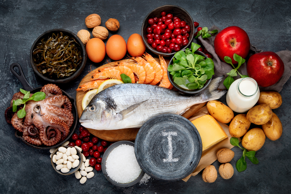 Food high in iodine on dark gray background. Healthy eating concept. Top view, flat lay
