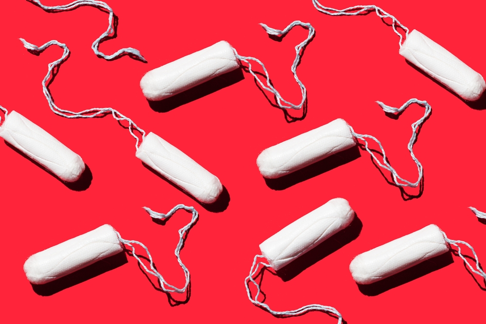 feminine hygiene tampons on a red background. Menstruation concept
