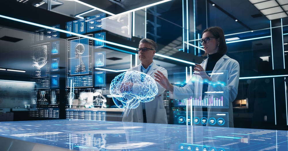 Two Neuroscientists Working With Computer-Powered VFX Hologram Of Human Brain And Nervous System In Futuristic Laboratory. Caucasian Man And Woman Working On Solutions for Brain Damage Or Trumor
