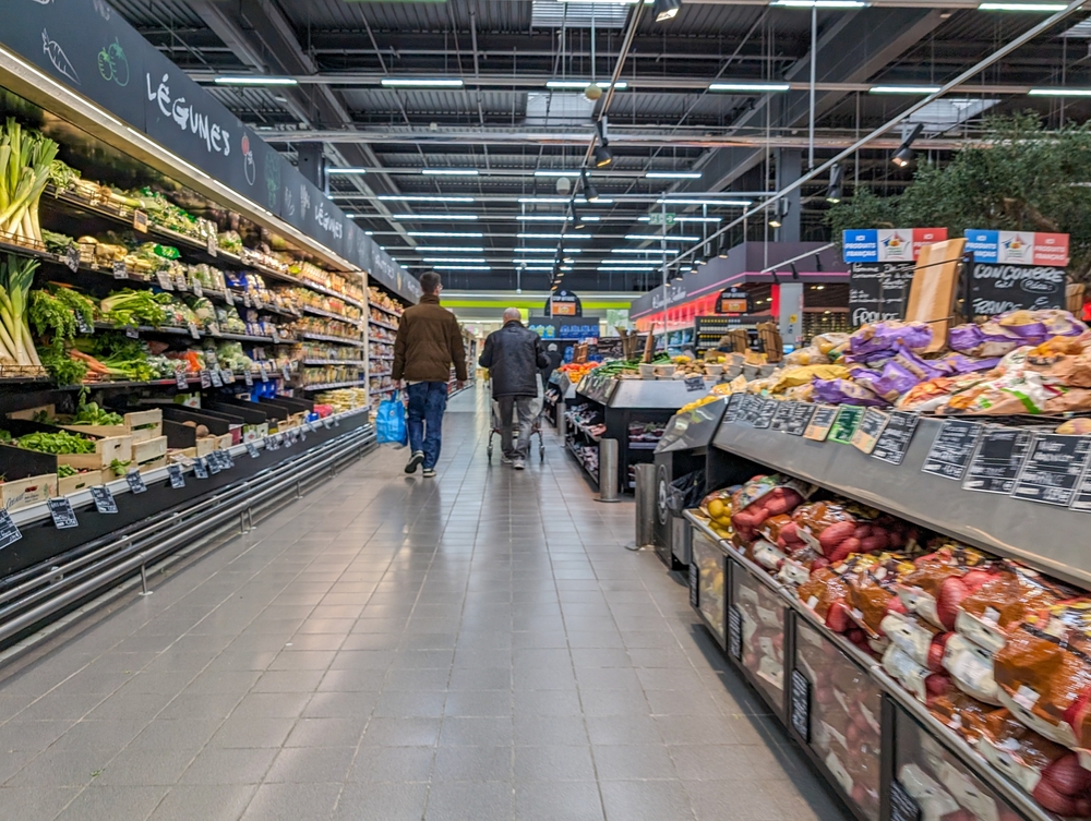 France, 6 March 2024: Shoppers in Supermarket Produce Aisle

