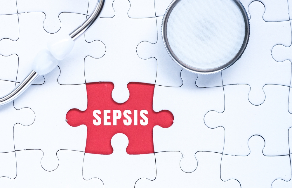SEPSIS word alphabet letters on puzzle as a background with stethoscope