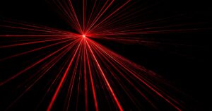 Red laser beam light effect on black background