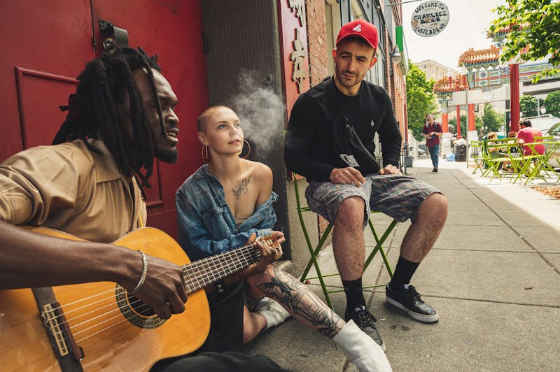 Group of people with one smoking