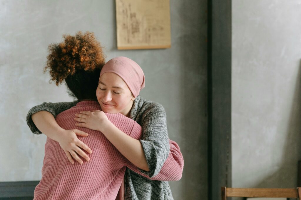 Women Hugging Each Other 