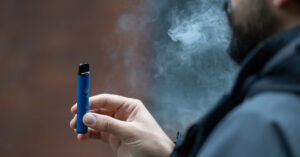 person using e-cigarette. Vaping concept