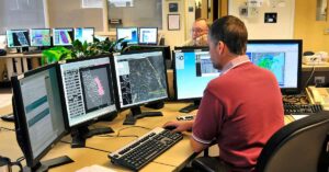 Hurricane Watchers Say Storm Nadine Could Turn in Hurricane Meteorologist in Work Area in Doppler Radar Station with National Oceanic and Atmospheric Administration NOAA National Weather Service.