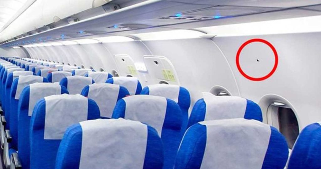 What Do Those Triangle Stickers Above Your Airplane Seat Mean? The
