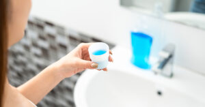 person holding mouth wash