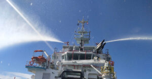 Tug boat spraying water