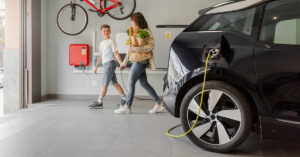 Stanford Research Gives Warning About Charging Electric Vehicles at Home Overnight electric vehicle being charged in person home garage