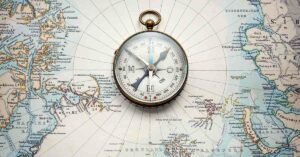 Earth's Magnetic North Pole Officially Has A New Position Compass placed in the center of the North Pole on a map