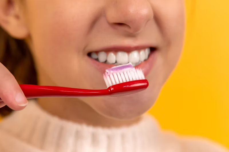 a girl about to brush her teeth