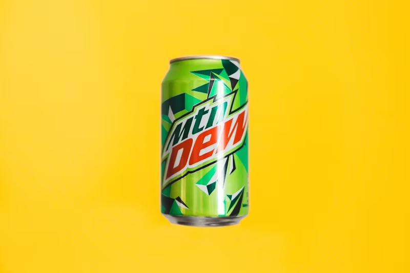 Mountain Dew can on a yellow backdrop