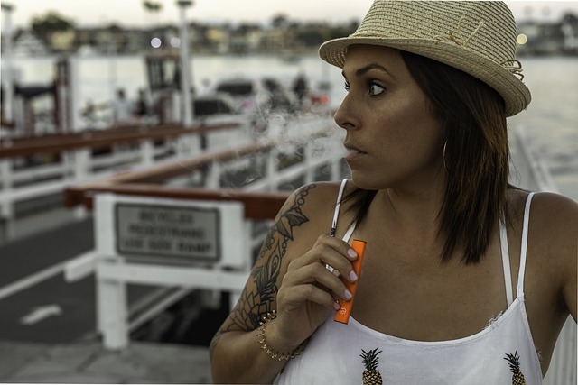 woman vaping on a deck