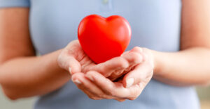 Person Holding Heart Shaped Obect