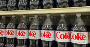 Everything You Should Know Before Sipping That Next Diet Coke large 2L plastic bottles of diet coke on shelf