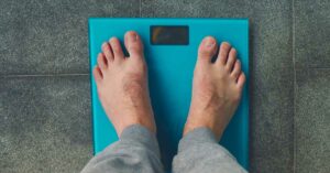 person standing on scale