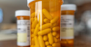 pills in transparent orange medication bottle