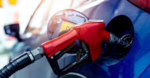 Is the Move to Ban Gas Cars a Risk to Personal Liberty? gas pump inserted into car