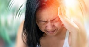 How to Help Get Rid of Vertigo Before It Becomes a Chronic Problem Vertigo illness concept. Woman hands on his head felling headache dizzy sense of spinning dizziness,a problem with the inner ear, brain, or sensory nerve pathway.