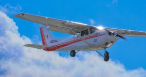 Cessna 172 Skyhawk aircraft is ascending the sky.
