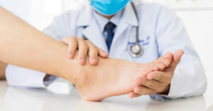 doctor examining a person's food. Diabetic symptoms in feet concept