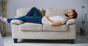 man laying on a couch