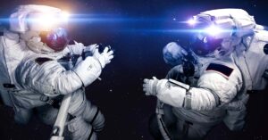 two astronauts wearing space suits