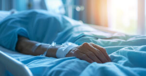 Doctor Reveals What Adults and Children See When They Die person in hospital gown laying in bed