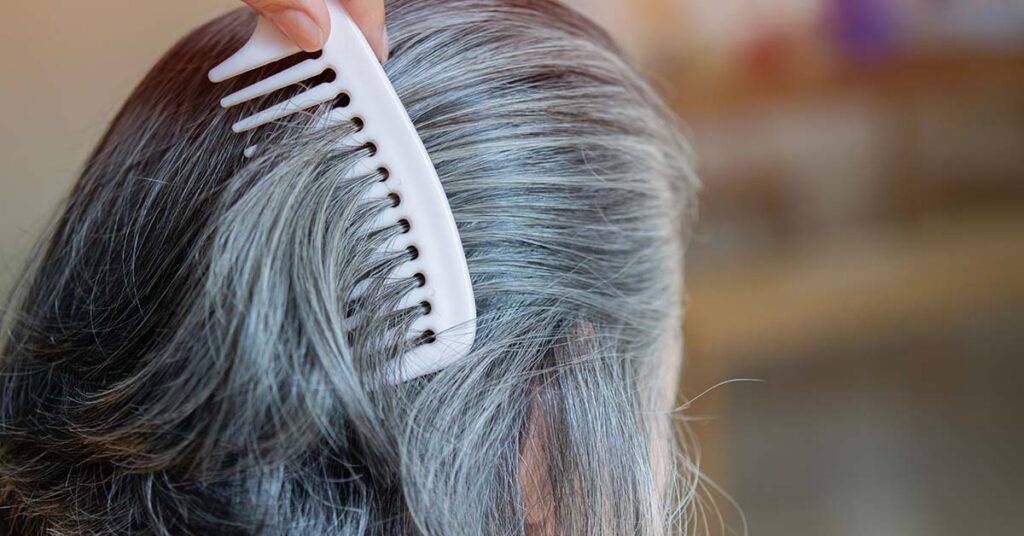 The Surprising Health Risk Linked to Gray Hair, According to Doctors - Featured image