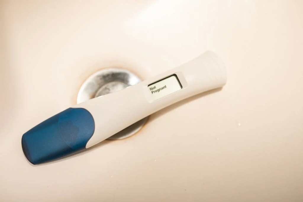 A negative digital pregnancy test, lying in a sink showing how the new sexually transmitted infection (new STI) affects fertility.