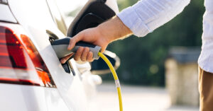 person charging an EV car