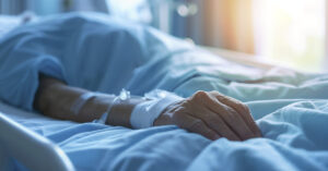Simulation Reveals What the Brain Experiences in the First 10 Minutes After Death person in hospital bed with IV connected to arm