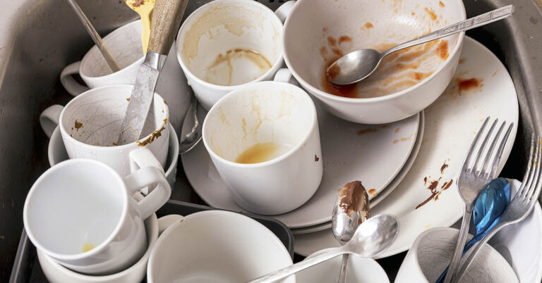 Why Letting Dishes Pile Up Could Be a Sign of Something Deeper, According to Psychology - Featured image