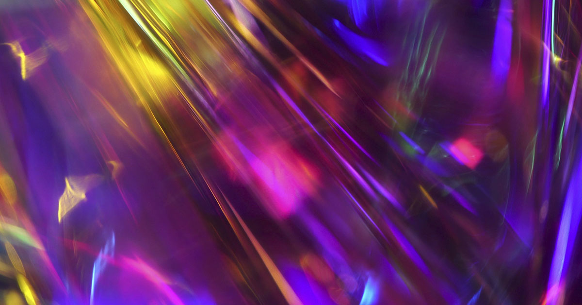 Futuristic glowing neon gold purple pink maroon red cyan blue abstract background for holiday. Unfocused night city traffic or Northern lights