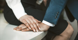 What Drives Women to Cheat? Insights from a Relationship Expert woman's hand placed on top of man's